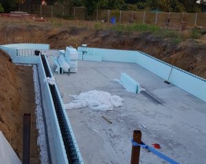 ICF building material being installed over hollowcore plank floor